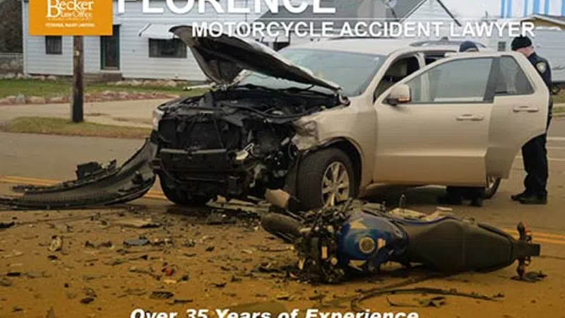 Damaged car and fallen motorcycle at accident scene with police and legal advertisement for Florence lawyer