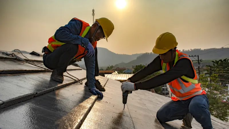 men on a roof