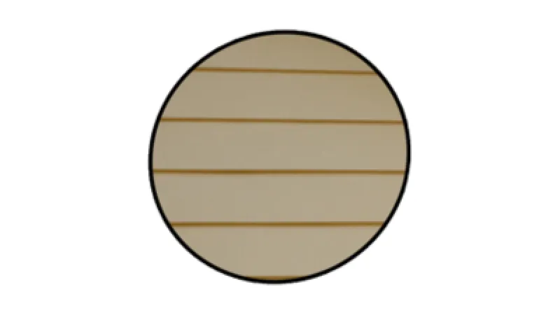 Circular close-up view of beige siding with horizontal yellowish lines on white background.