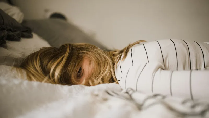 a woman lying on a bed