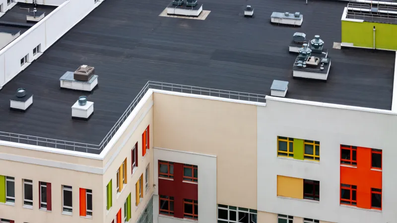 a building with cars parked in the front