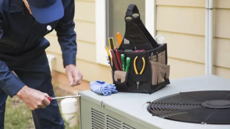 a person cleaning a table