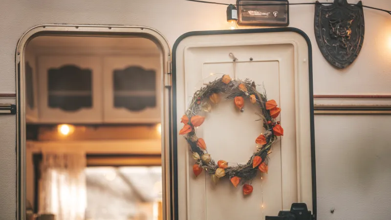 A wreath on the door of an RV