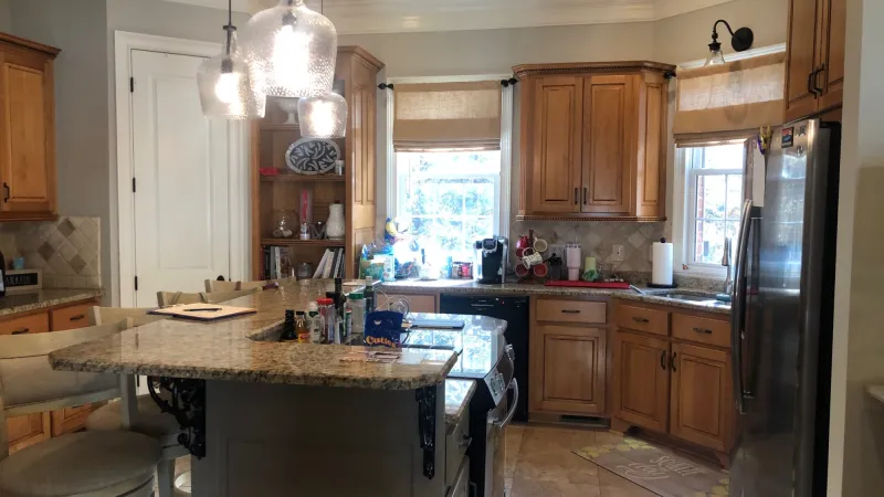 a kitchen with wooden cabinets