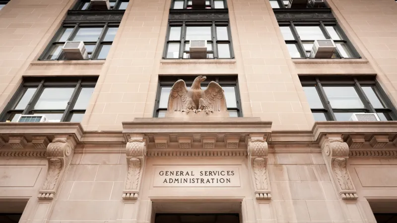 Facade of the General Services Administration building with an eagle sculpture above the entrance.