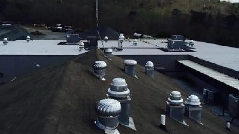 A before pictures showing how much the roof changed once the Standing Seam Seal Brown roof was installed.