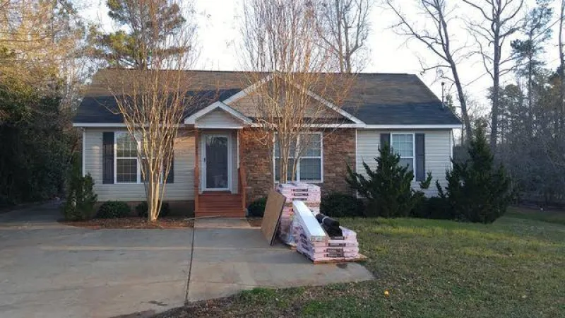 The materials are dropped and work is ready to begin. The shingle being used is the Owens Corning Duration with the Sure Nail technology. This shingle has a 130 mph wind gust warranty.