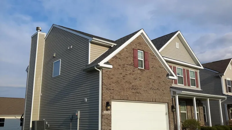 The Estate Gray color of the Duration shingle is a perfect complement to this home's exterior.