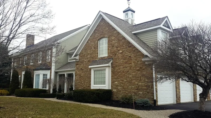 The Driftwood color of the Duration shingle is a perfect complement to this home's exterior.