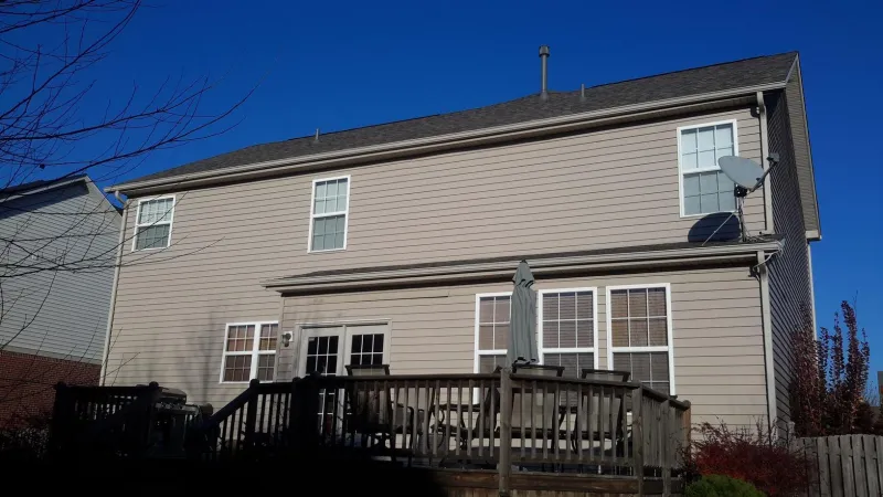 This roofing system replacement included removing all the old shingles, inspecting the decking, adding new felt paper, drip edges, and gutter aprons. It also included installing ice and water shield protection before layering on the shingles.