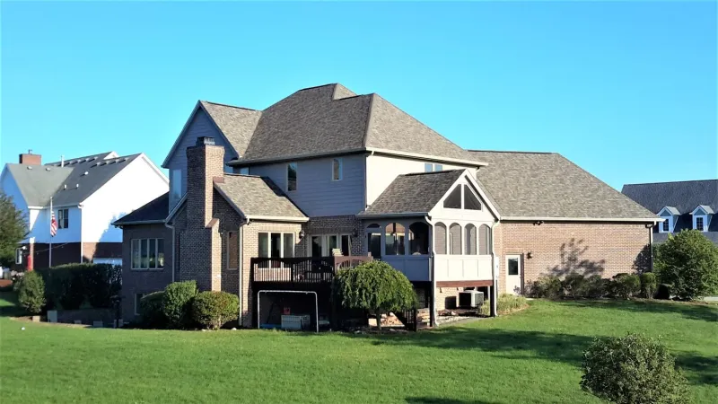 The Driftwood color of the Duration shingle is a perfect complement to this home's exterior.