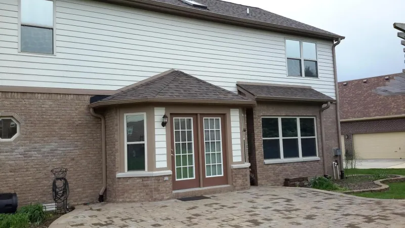 The shadow lines and dimensions of this roof add a unique shape to the home and create curb appeal.