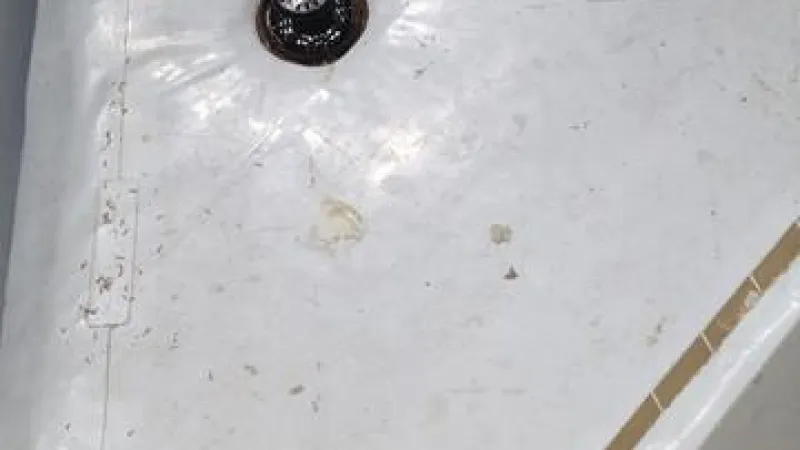 New aluminum drain installed to ensure proper drainage during rain events.