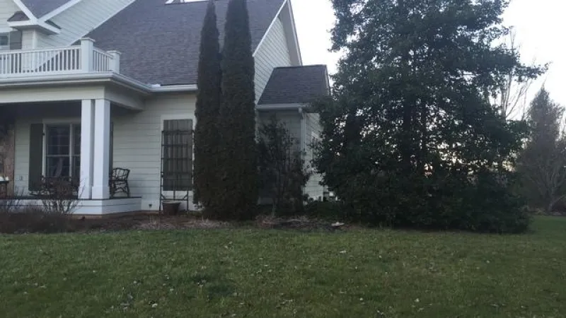 Side view of a home with Duration Driftwood Owens Corning shingle. 