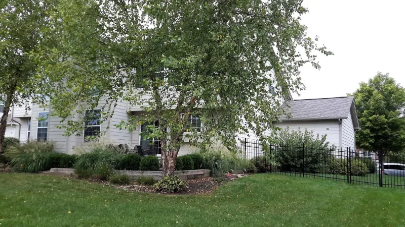 The Driftwood color of the Duration shingle is a perfect complement to this home's exterior.
