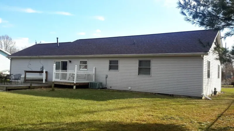 The Merlot color of the Duration shingle is a perfect complement to this home's exterior.