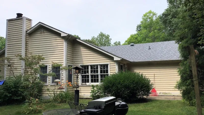 The Quarry Gray color of the Duration shingles is a perfect complement to this home's exterior.