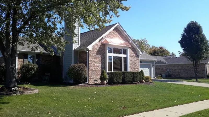 The copper shines on this bay window roof. With the new Owens Corning shingled roof and new gutters, this makeover is complete.