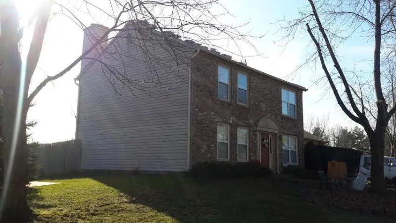 This home received a roof makeover with the Duration shingles in Merlot.
