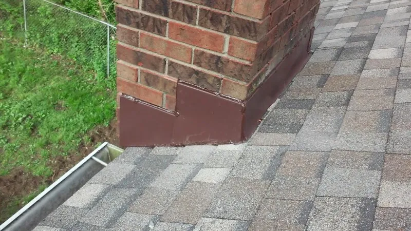 Both chimneys on this roof received new chimney flashing systems, as done on all Roof It Forward chimneys. New metal flashing and counter flashing were applied.