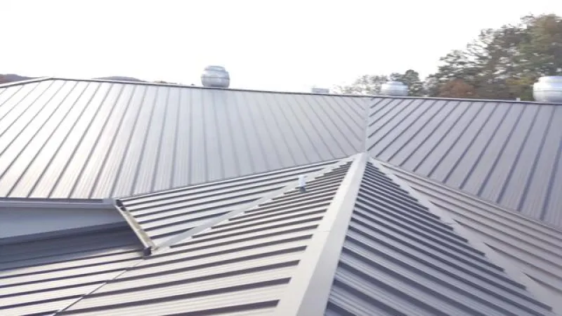 A great pictures showing how the ridges come in on this standing seam seal brown roof system.