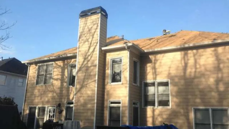 The shingles and felt have been removed