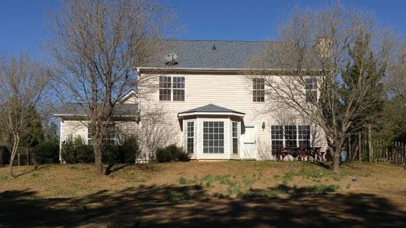 From the rear of the home these shingles look like a million bucks. The Owens Corning Duration in Pacific Blue.