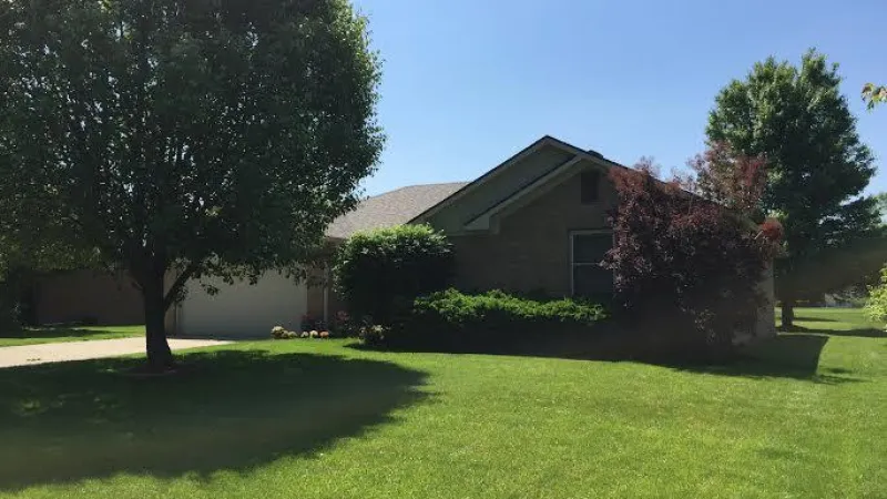 The Driftwood color is a perfect choice to match the earth tone colors of this home's exterior.