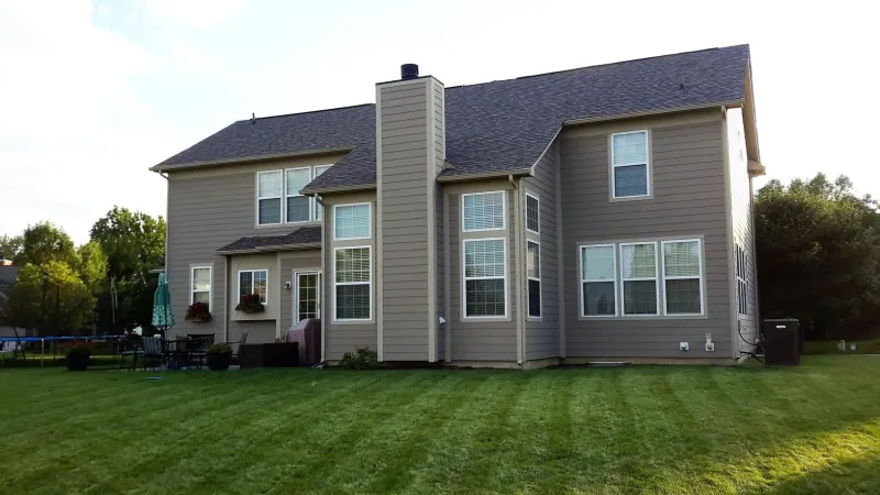 The Driftwood color of the Duration shingle is a perfect complement to this home's exterior.
