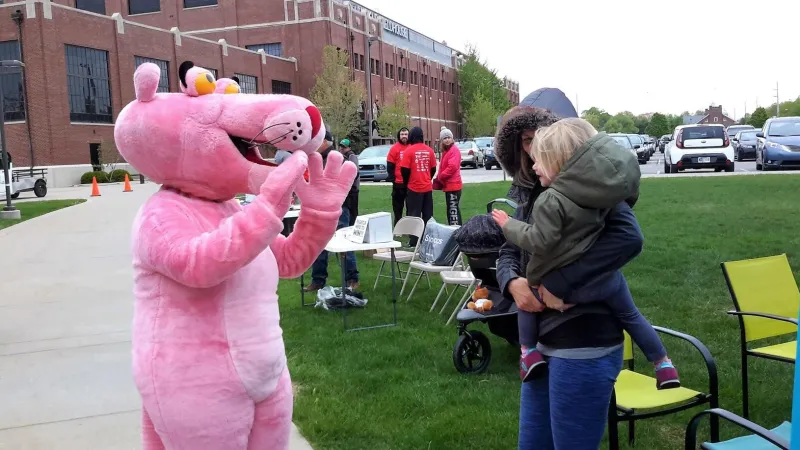 This baby is making friends with panther.