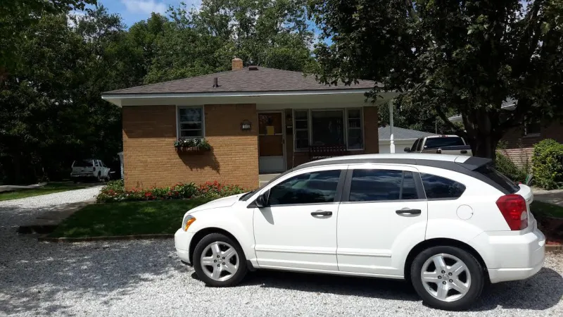 The Duration shingle in Teak is the perfect complement to this home, creating a beautiful, dimensional appearance.