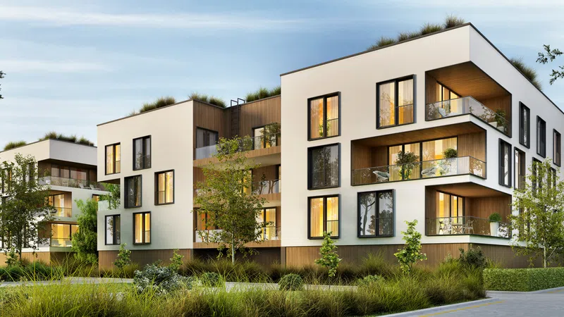 Modern apartment complex with lush greenery and stylish architecture, featuring large windows and terraces.