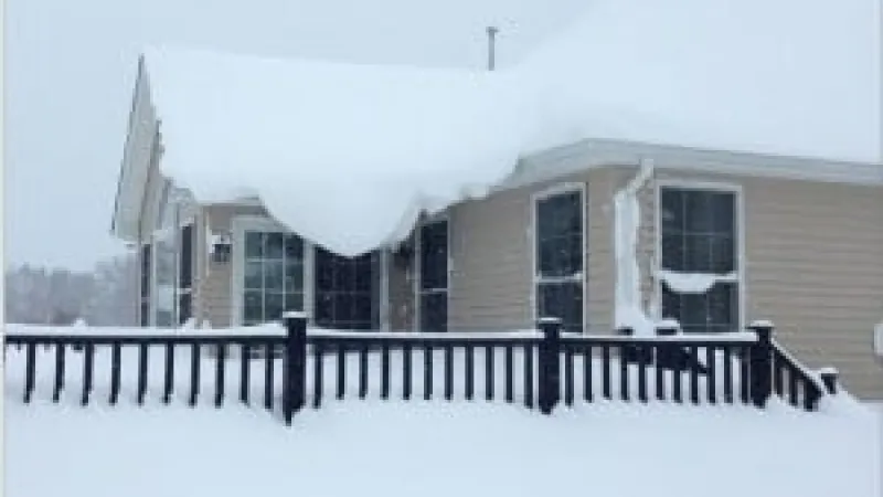 a house with a fence in the front