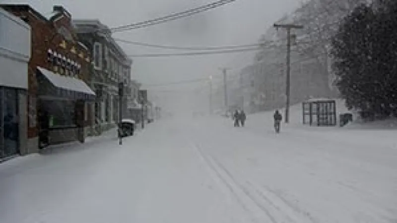 people walking on a snowy street