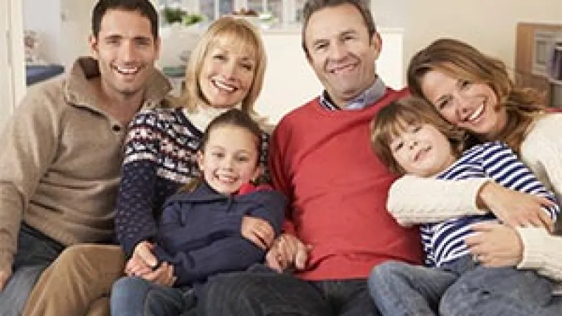 a family sitting on a couch