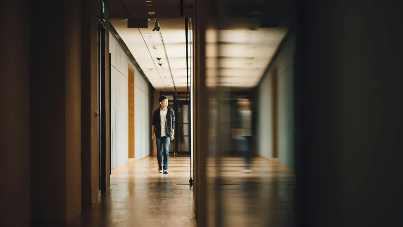 a person walking down a hallway