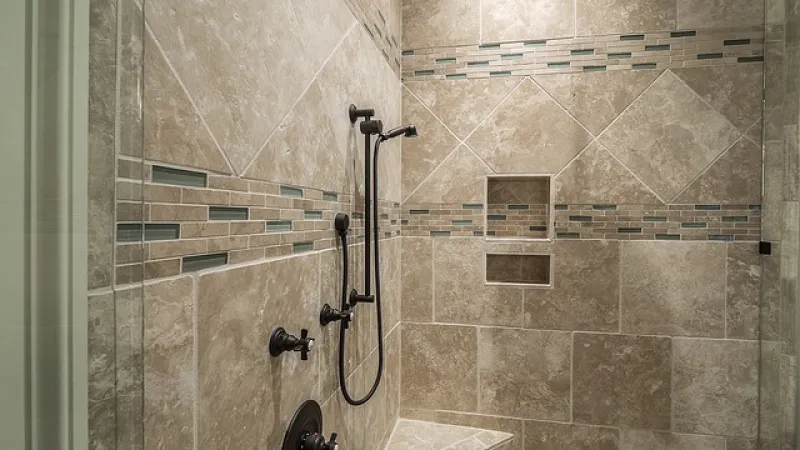 a shower with a tile wall
