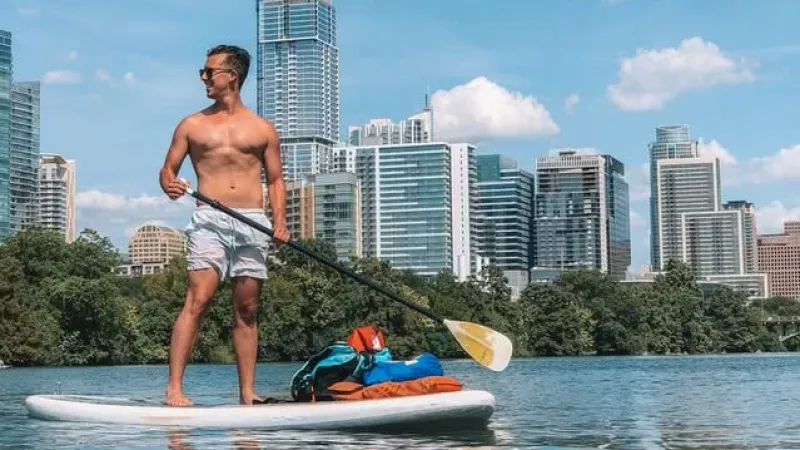 a man paddle boarding