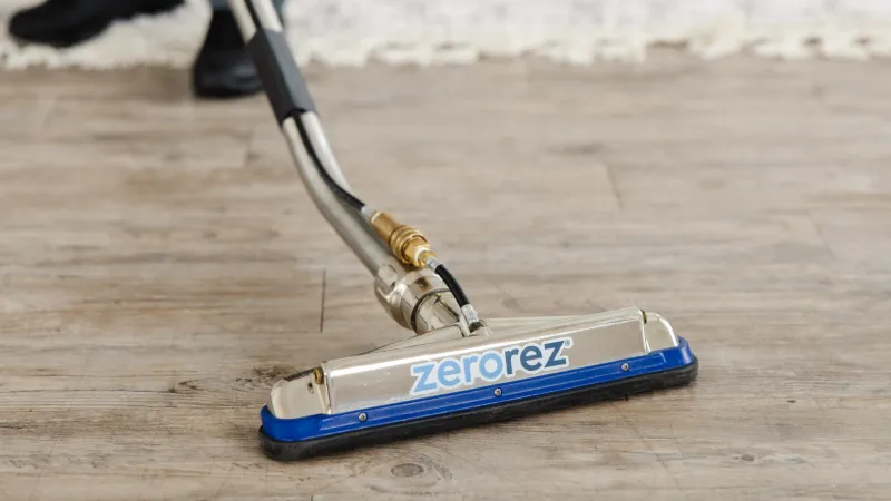 Zerorez technician using a Zr Wand cleaning a laminate floor