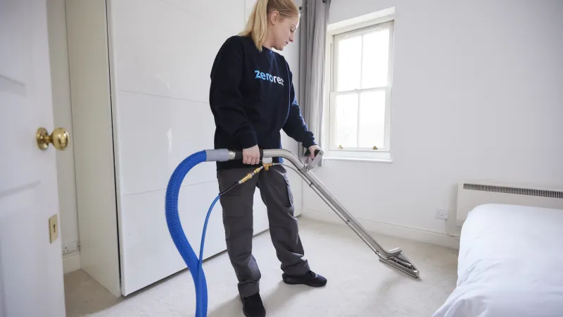 a person holding a broom