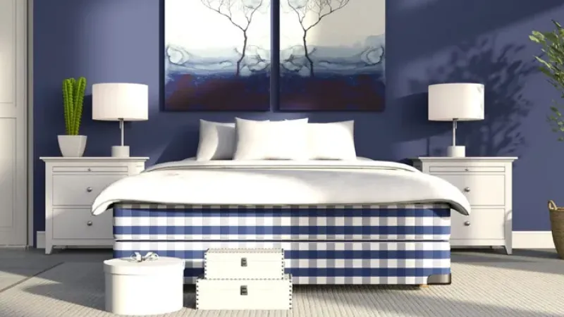 a bed with a blue and white striped cover