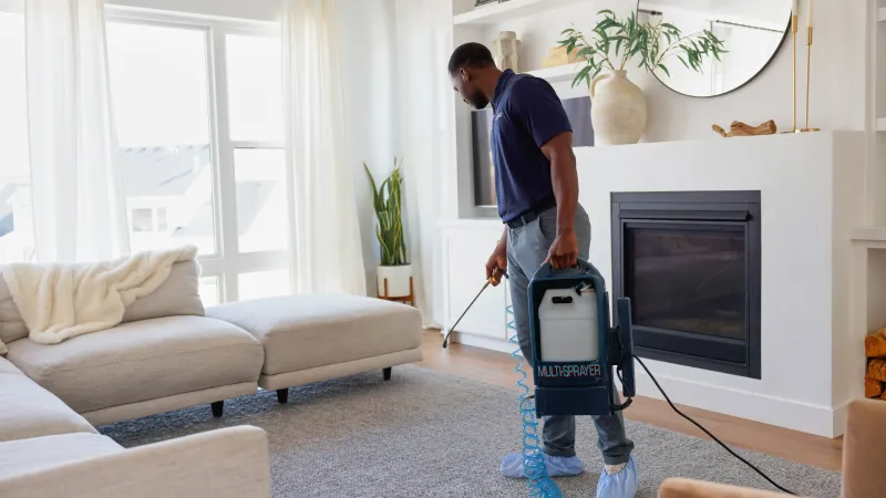 a person holding a vacuum cleaner