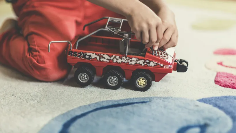 a person using a toy truck