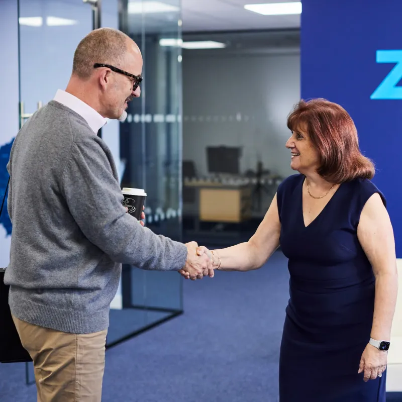 a man and a woman shaking hands