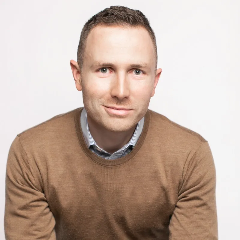 a man wearing a brown shirt