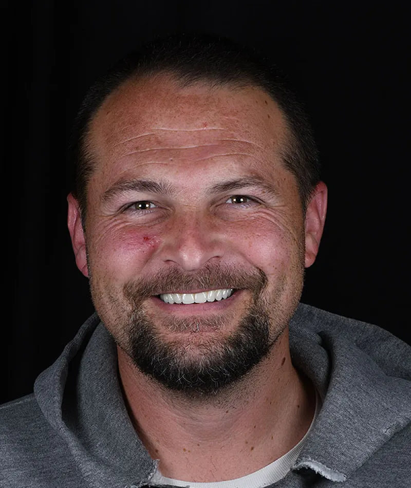a man smiling for the camera