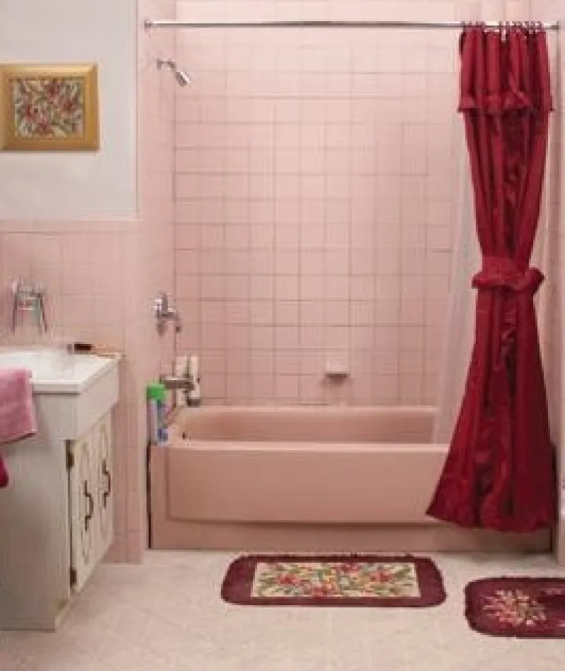 a bathroom with pink towels