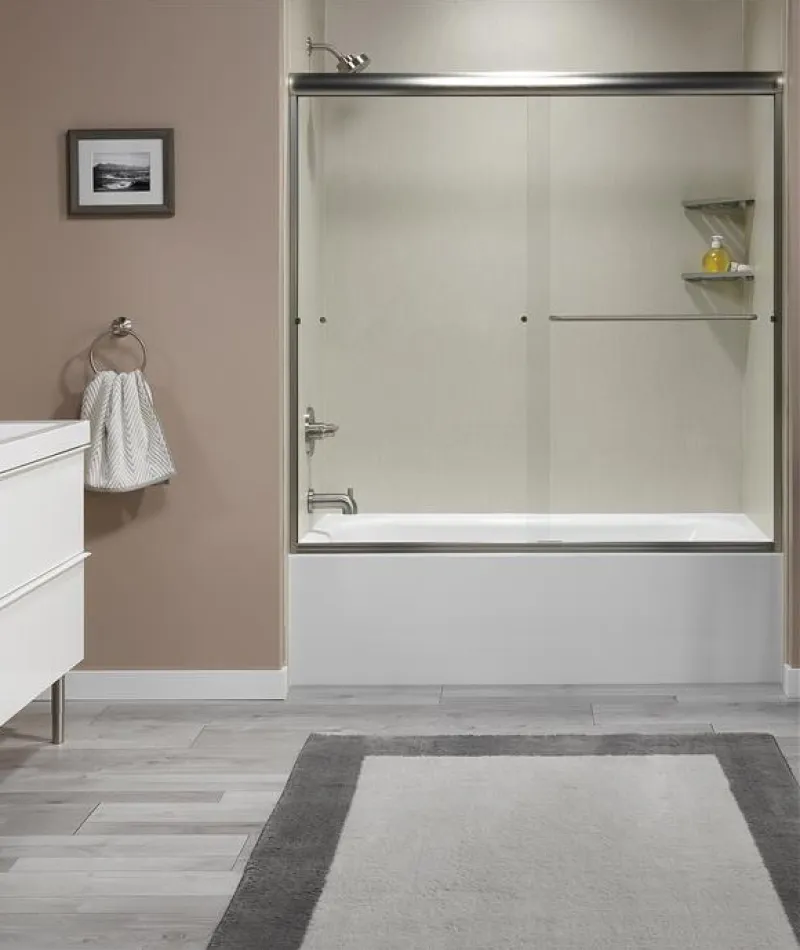 a bathroom with a shower unit and sink