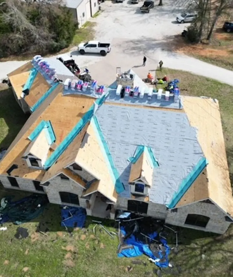 a house being built with a lot of people around it