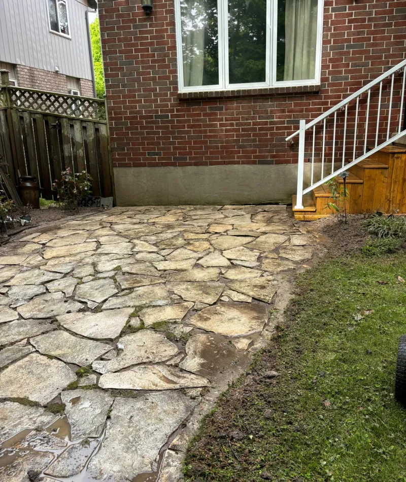 Outdoor stone patio after Men In Kilts York Region pressure washed the walkway and stones